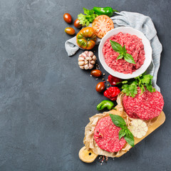 Homemade raw organic minced beef meat burger cutlet and vegetables