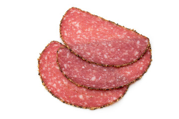 Salami slices isolated on the white background.