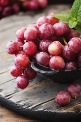 Sweet red grape on the wooden table