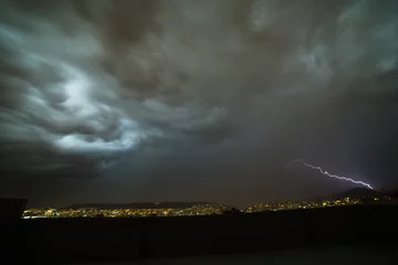 Fotobehang Storm clouds and lightning © ecuadorquerido