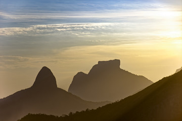 Silhuete of Gavea stone and Two Brothers hill in Rio de Janeiro during sunset