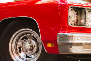 Fototapeta na wymiar Close-up of headlights of red vintage car