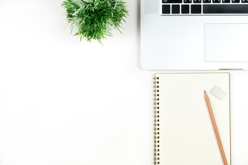 Business office work desk table with computer laptop , note and stationery on white table background include copyspace for add text or graphic