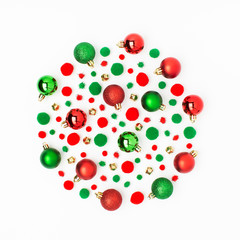 Christmas round composition made of red and green Christmas balls on white background. Flat lay, top view