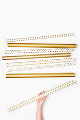 Christmas collection wrapping paper in gold and black colors. View from above. Flat lay