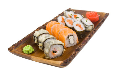 assorti set sushi on wooden board isolated on white background