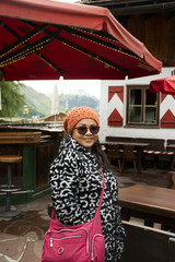 Asian thai old woman posing for take photo at Samnaun village in Graubunden, Switzerland