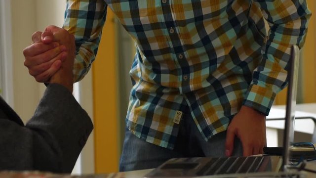 Coworkers analyzing project on notebook