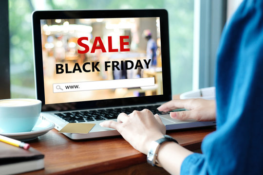Woman hands typing laptop computer with www. on search bar over black friday sale banner background, Holiday shopping online, business and technology