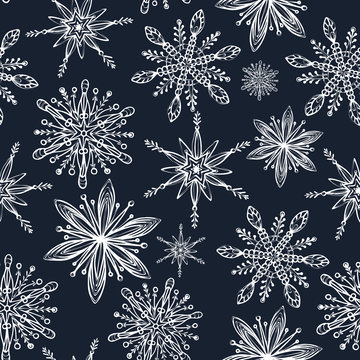 Winter seamless pattern. Hand drawn creative snowflakes. Snowfall. Artistic background with decorative snow. It can be used for wallpaper, textiles, wrapping, card, cover. Vector illustration, eps10