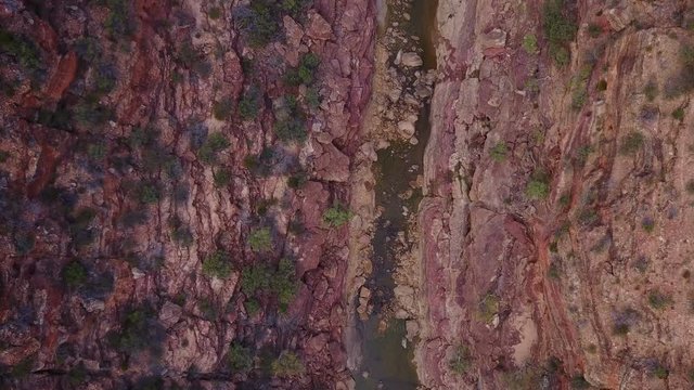 Drone following river through canyon