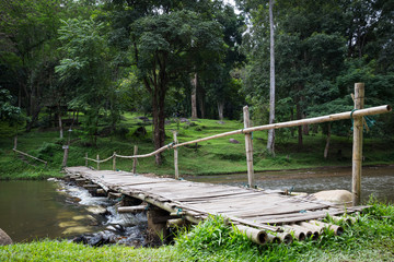 wood bridge across canel