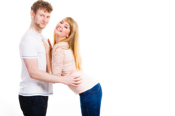 Happy enamoured couple hugging each other.