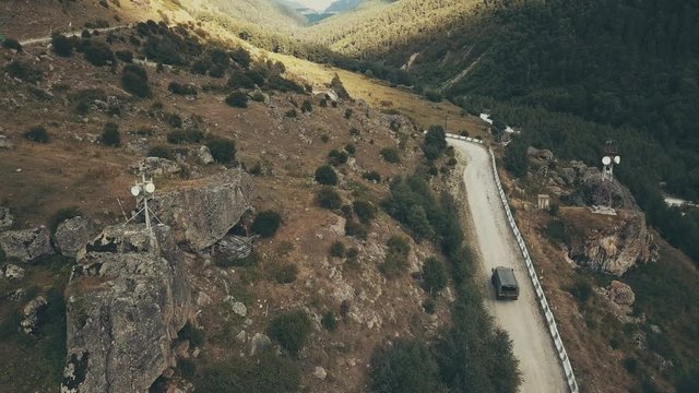 Drone view truck car driving along winding road mountain at sumer day