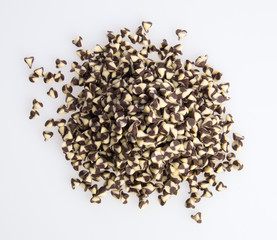 Chocolate chip morsels spread on a background.