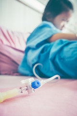 Closeup of hand adjust iv hose for patient. Health care stories.