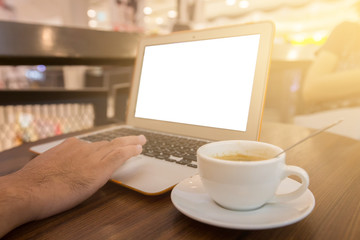 Close up of business man hand working on blank screen laptop computer in cafe blur or blurred soft focus