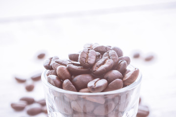 Top view of coffee beans with glass shot. vintage color effected