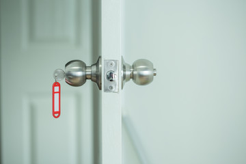 Red key tag with opened door