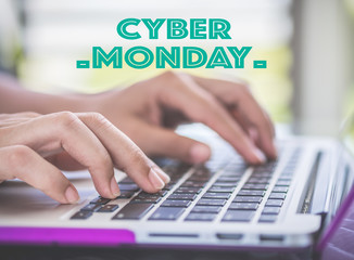Woman hand using laptop computer and selecting cyber monday , sale concept.
