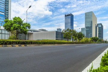 Obraz na płótnie Canvas empty road and modern office buildings.