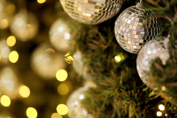 Fototapeta na wymiar close up mirror ball or Christmas ball to decorative for Christmas festival with bokeh background. Have some space for write wording