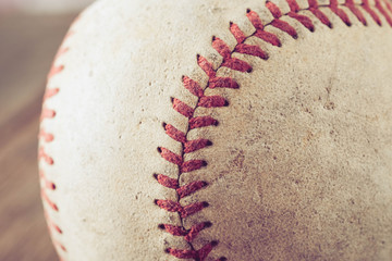 Fototapeta na wymiar old Baseball on wood background with filter effect retro vintage style