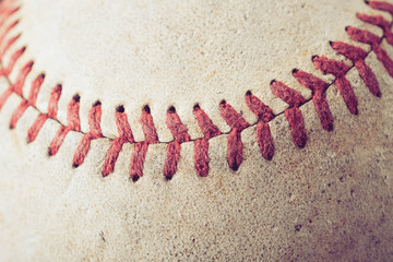 Fototapeta na wymiar old Baseball on wood background with filter effect retro vintage style