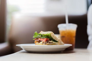 Fresh sandwich with guacamole, tomatoes, arugula and bacon