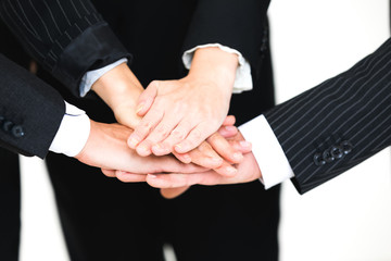 Group of people joining their hands. Teamwork concept.
