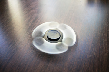 A toy for fun. Fun, have fun. Photo of a black spinner.