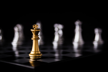 Business leader in competition and strategy plan success meaning with chess board game background