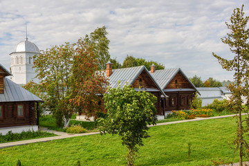 Fototapeta na wymiar View of old wooden houses in Suzdal city. Russia. Home for nuns in an ancient monastery.