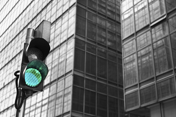Traffic light with urban background