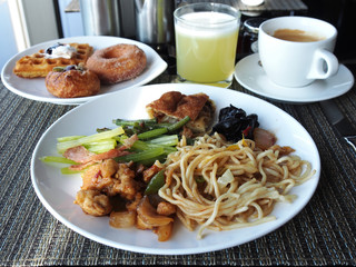Asian style breakfast buffet on the table at hotel  