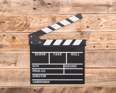 Clapperboard on wood background