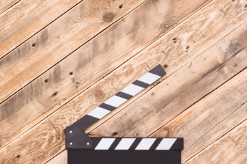 clapperboard on wood background