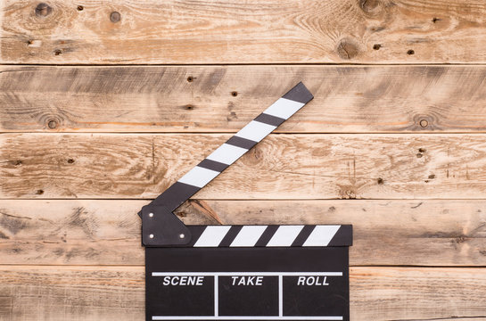 clapperboard on wood background