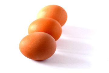 Three eggs on a white background