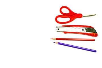 Stationary with scissor,cutter,pencil in red tone isolated on white for copy space