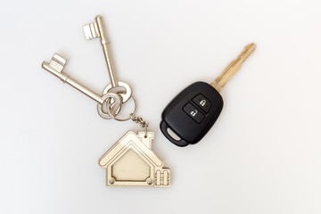 Car and house keys on table. Concept of success.