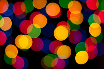 Colorful bokeh lights of Christmas garland. Blurred background.