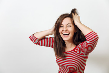 Fototapeta na wymiar Gorgeous European young happy brown-haired woman with healthy clean skin and charming smile, dressed in casual red and grey clothes, laughing and enjoying on a white background. Emotions concept.