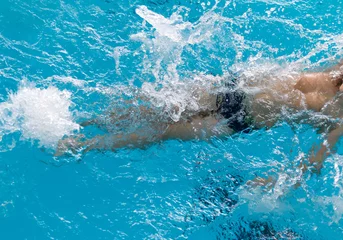 Poster Im Rahmen boy on a swim in a sports pool © schankz