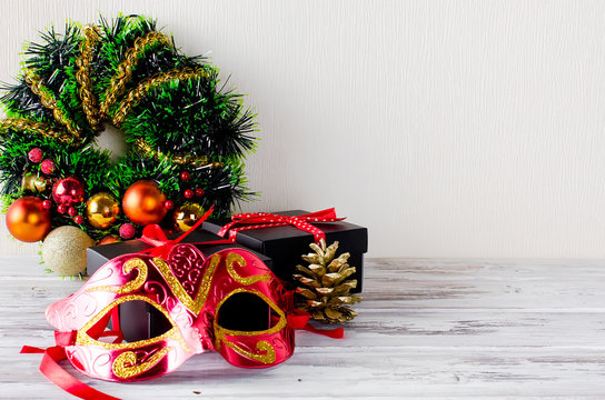 Xmas  wreath, black christmas  gift  box with red ribbon and nask