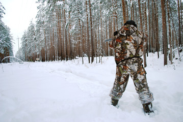 man shoots at a target.