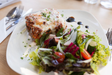 Authentic Italian Meat Lasagna with fresh salad