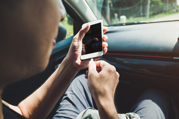 Man using phone in the car