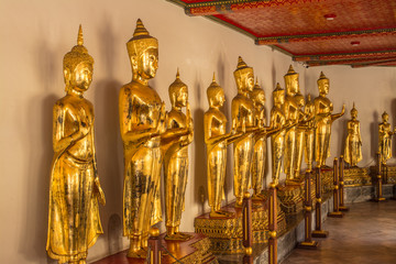 Standing Buddha image at Wat Pho that is a Buddhist temple complex Chinese and Thai style in Bangkok, Thailand