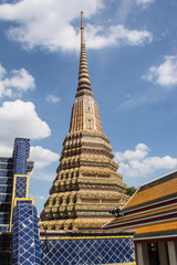 Fototapeta premium Pagoda is in Wat Pho that was named as the temple of the pagoda or chedi that are decorated with yellow glaze or glazed tiles or dark blue